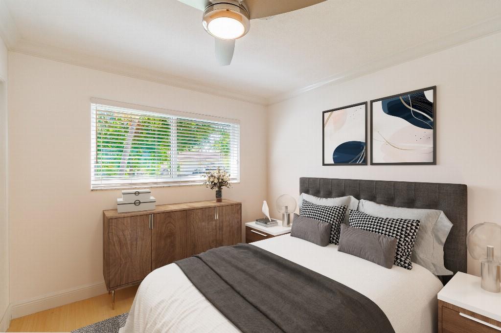 2650 Northeast 52nd Street Lighthouse Point, FL 33064 - Photo 6 of 35 a bedroom with a bed and a window