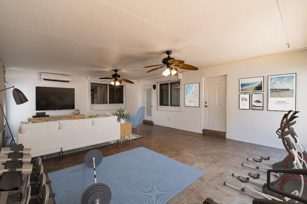 2650 Northeast 52nd Street Lighthouse Point, FL 33064 - Photo 8 of 35 a view of a livingroom with furniture and a flat screen tv
