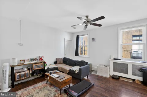 a living room with furniture and a window
