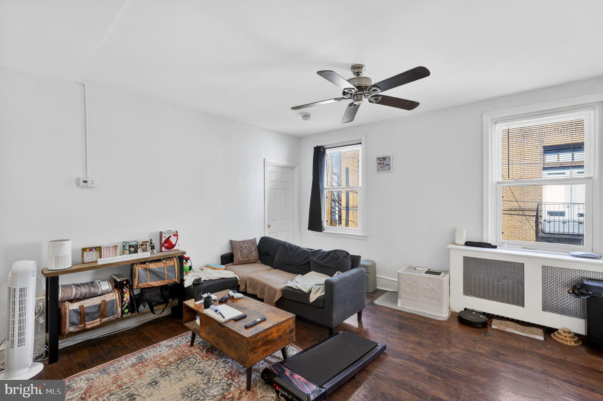 1229 South 6th Street Philadelphia, PA 19147 - Photo 15 of 36 a living room with furniture and a window