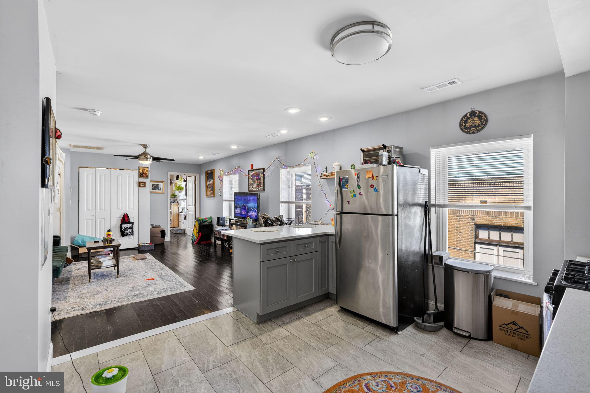 1229 South 6th Street Philadelphia, PA 19147 - Photo 28 of 36 a kitchen with stainless steel appliances granite countertop a refrigerator and a sink