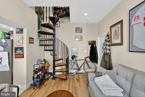a view of a livingroom with furniture and workspace