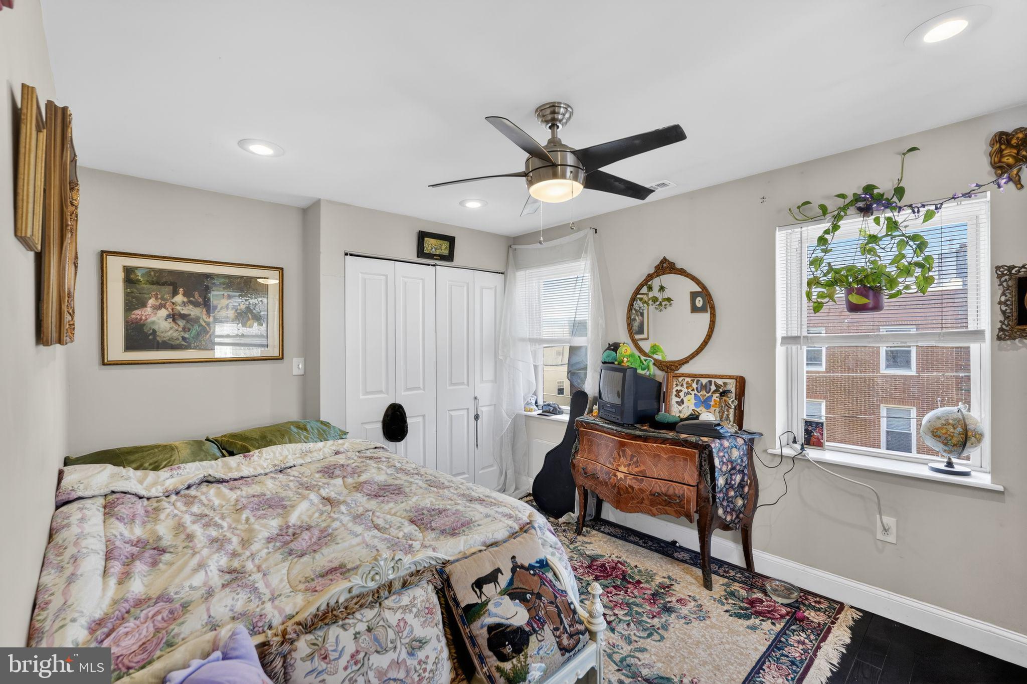 1229 South 6th Street Philadelphia, PA 19147 - Photo 31 of 36 a bed room with a bed mirror and a window