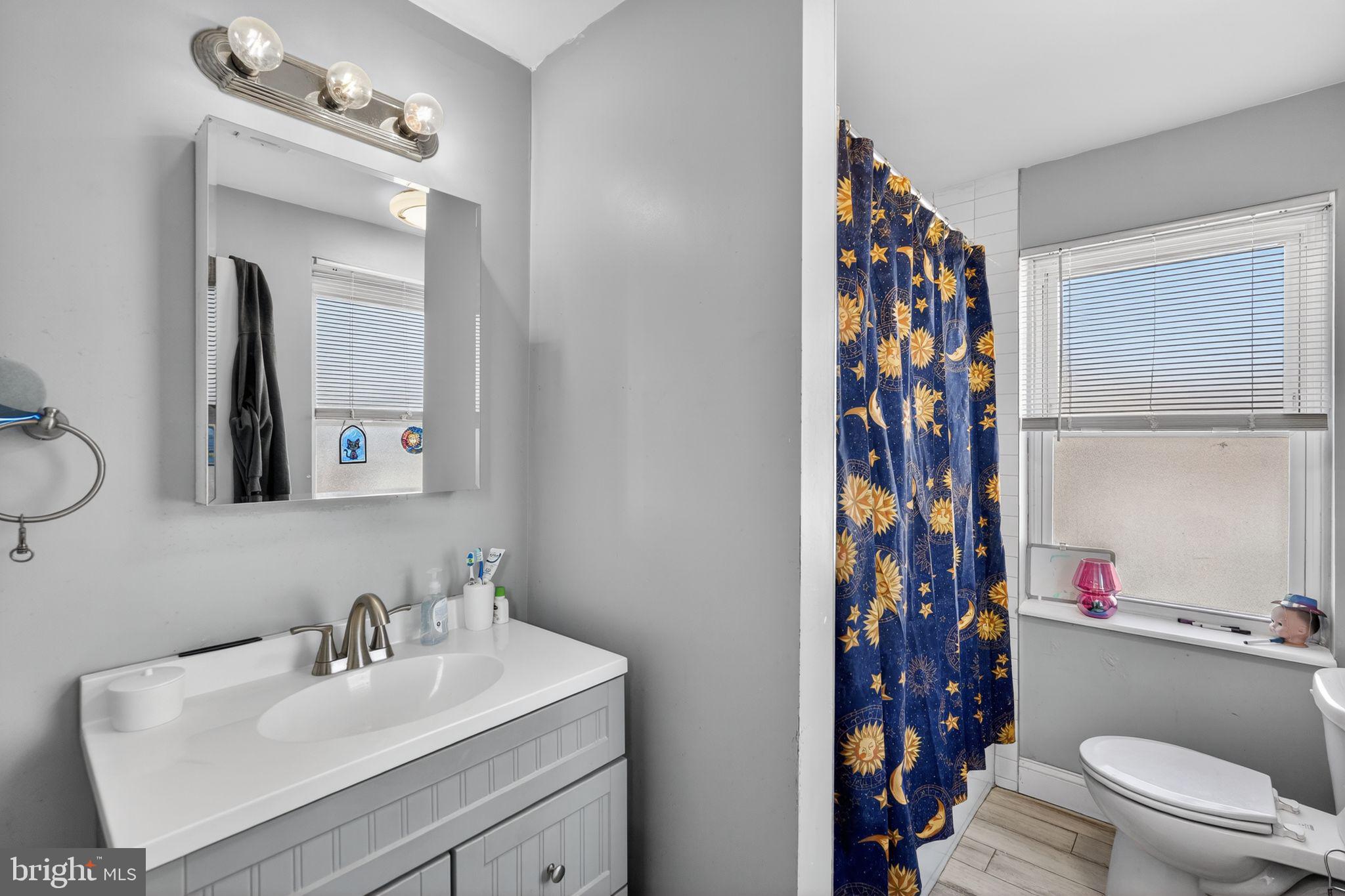1229 South 6th Street Philadelphia, PA 19147 - Photo 32 of 36 a bathroom with a sink toilet and shower