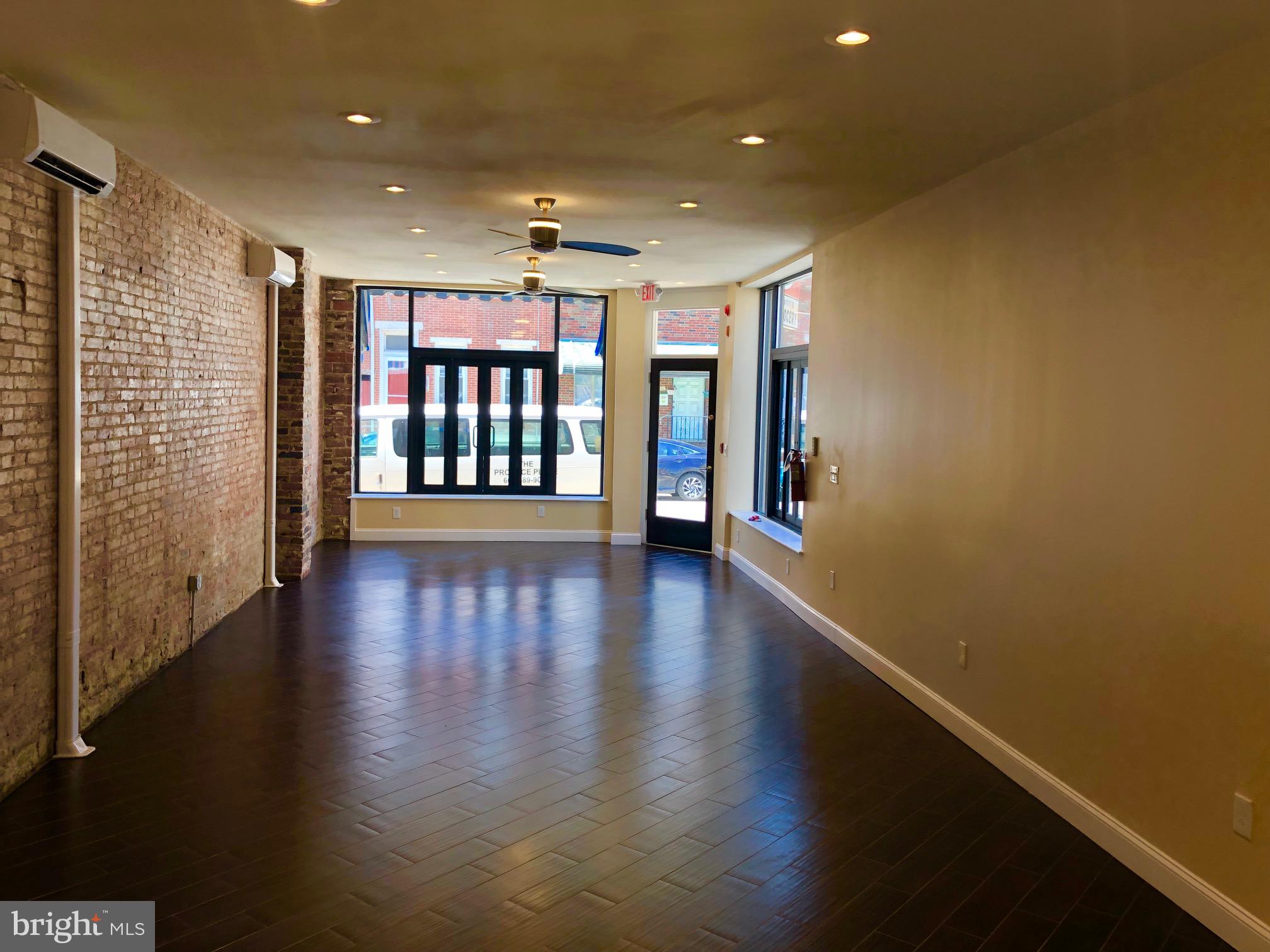 1229 South 6th Street Philadelphia, PA 19147 - Photo 33 of 36 a view of a hallway with wooden floor