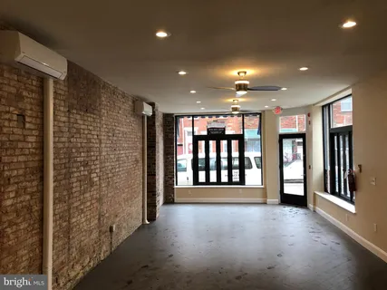 a view of an entryway with a hallway