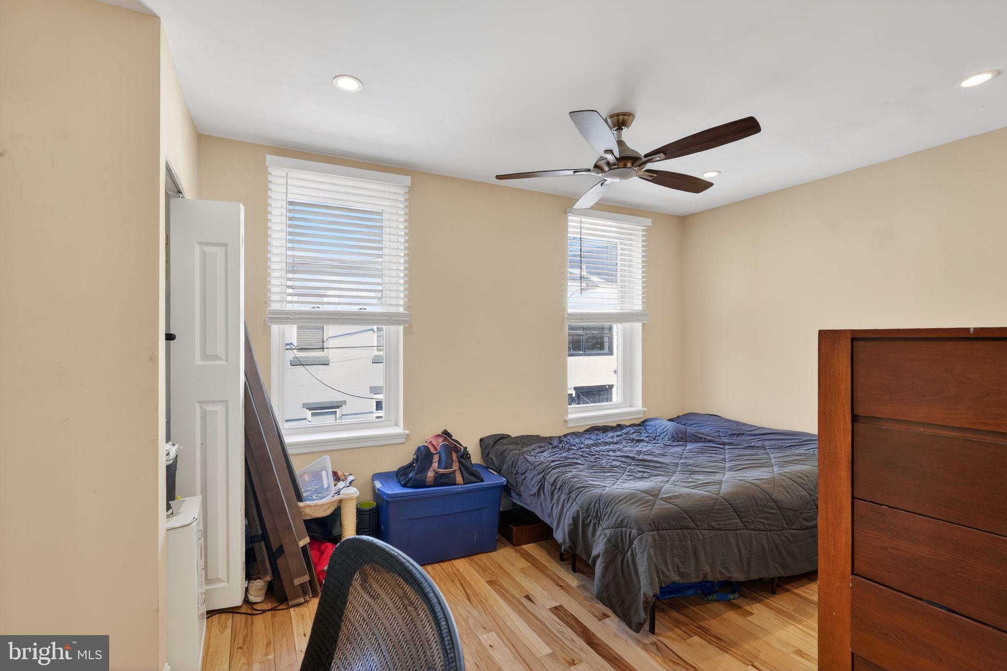 1229 South 6th Street Philadelphia, PA 19147 - Photo 8 of 36 a bedroom with a bed and wooden floor