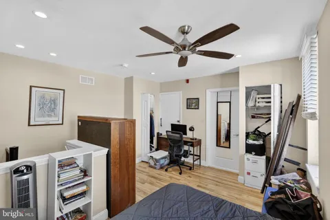 a view of a livingroom with furniture and a flat screen tv