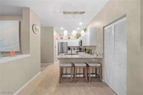 a kitchen with a refrigerator a sink and dishwasher
