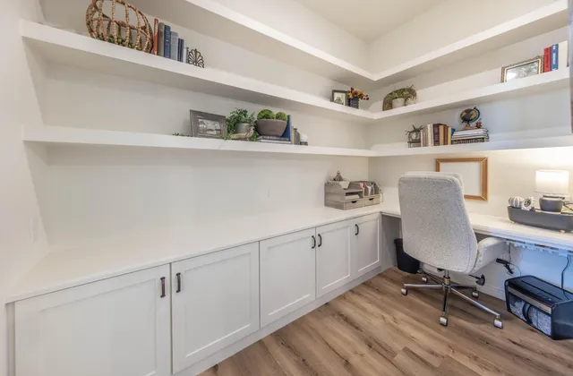 a bedroom with furniture and a flat screen tv