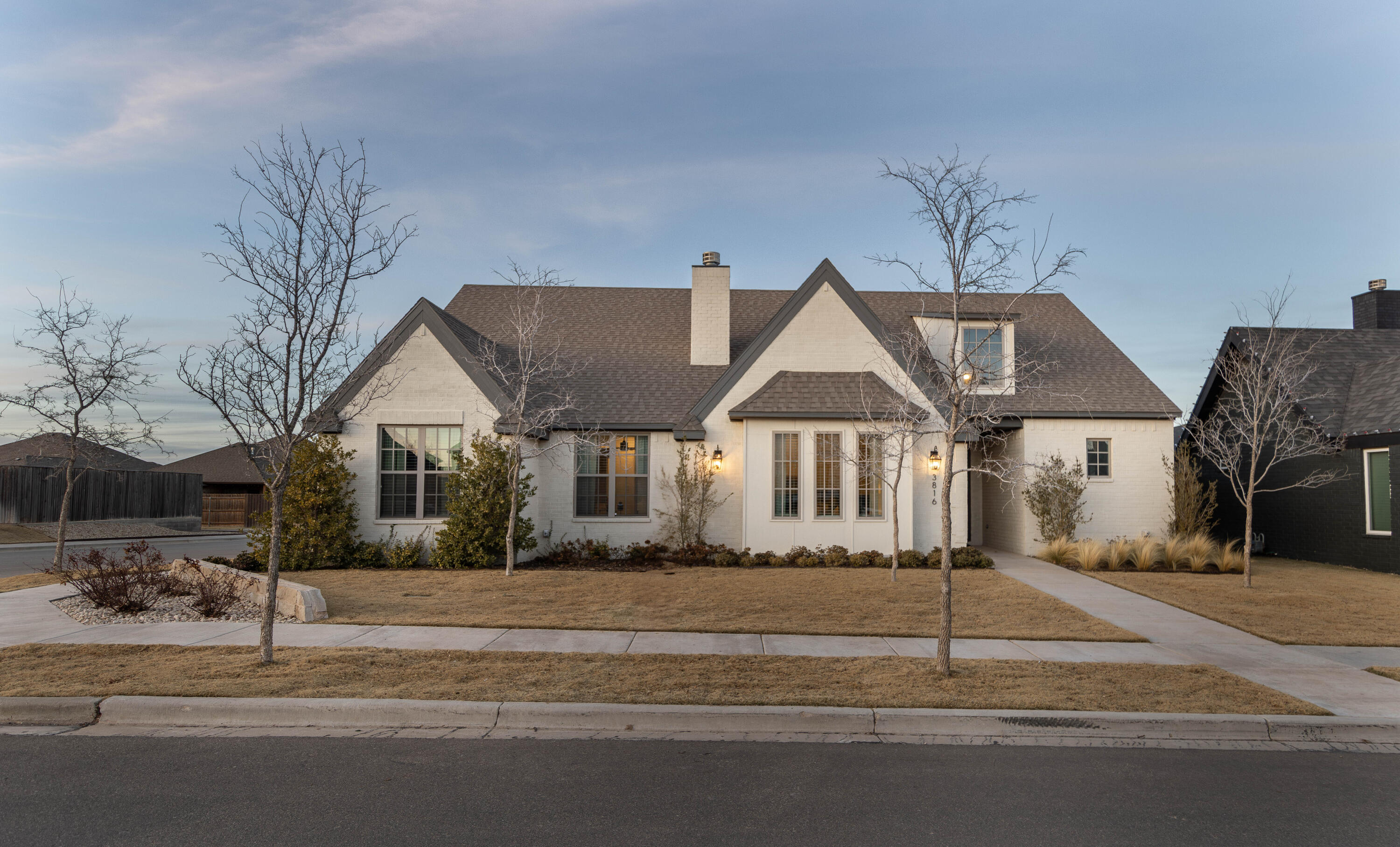 3816 128th Street Lubbock, TX 79423 - Photo 2 of 47 a front view of a house with a yard