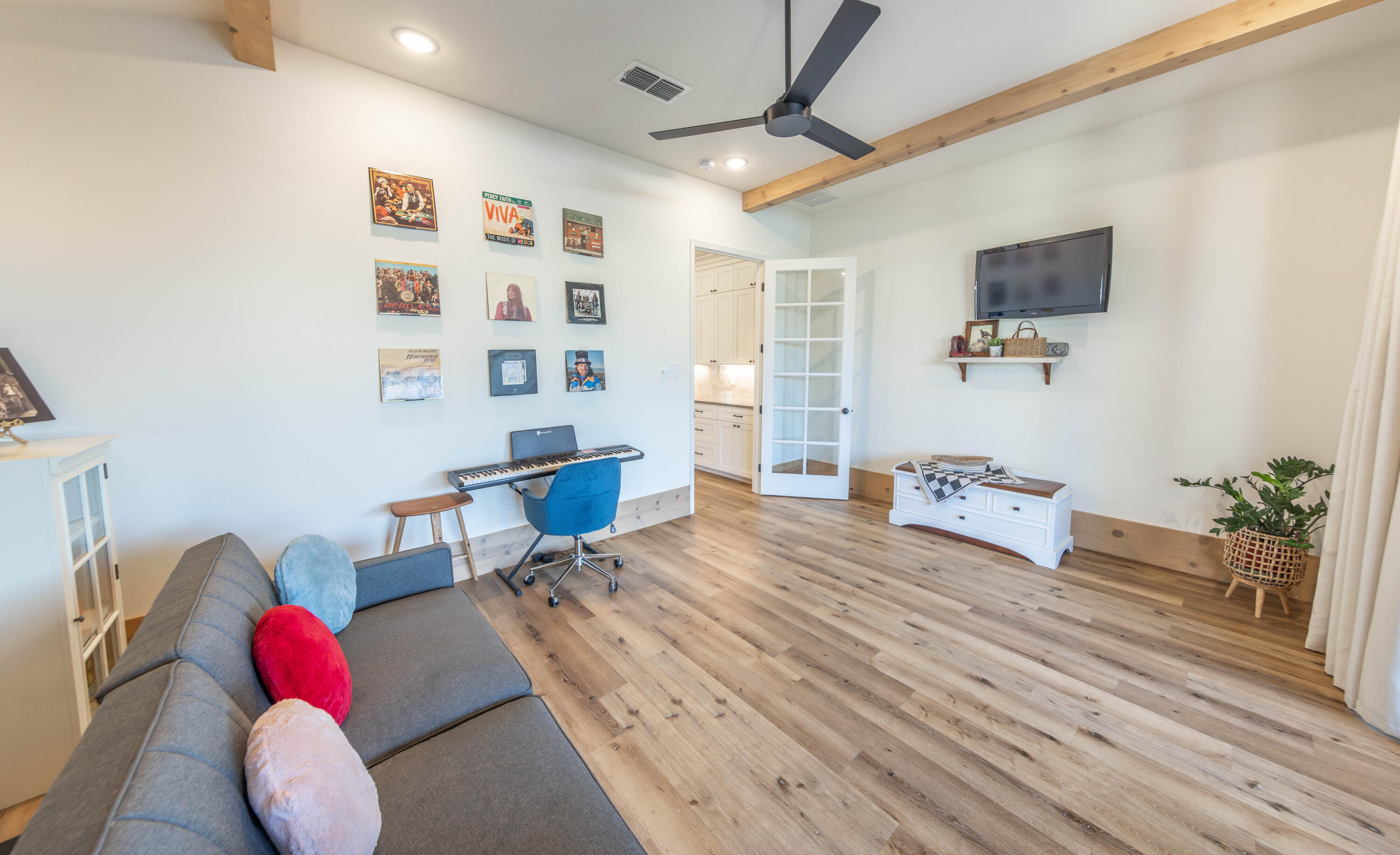 3816 128th Street Lubbock, TX 79423 - Photo 30 of 47 a bedroom with furniture and a flat screen tv