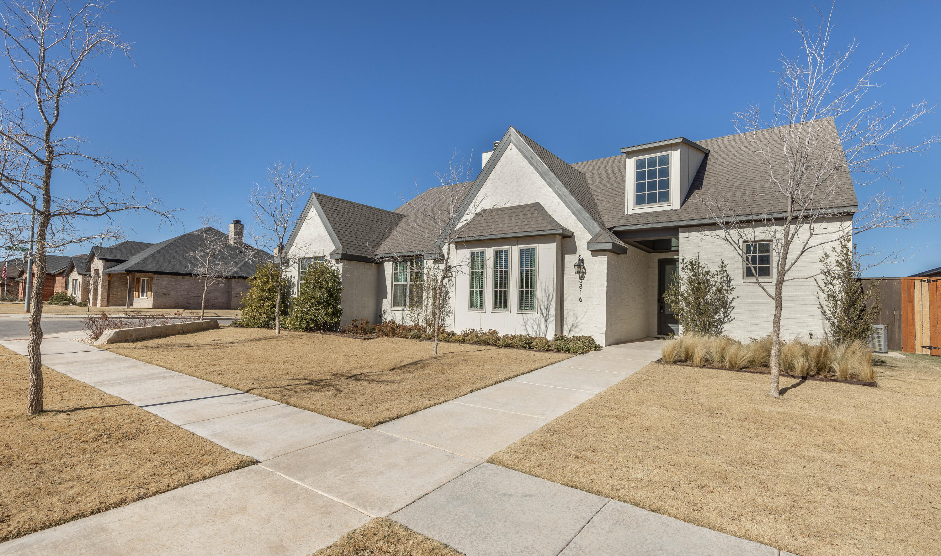 3816 128th Street Lubbock, TX 79423 - Photo 41 of 47 a front view of a house with a yard and garage