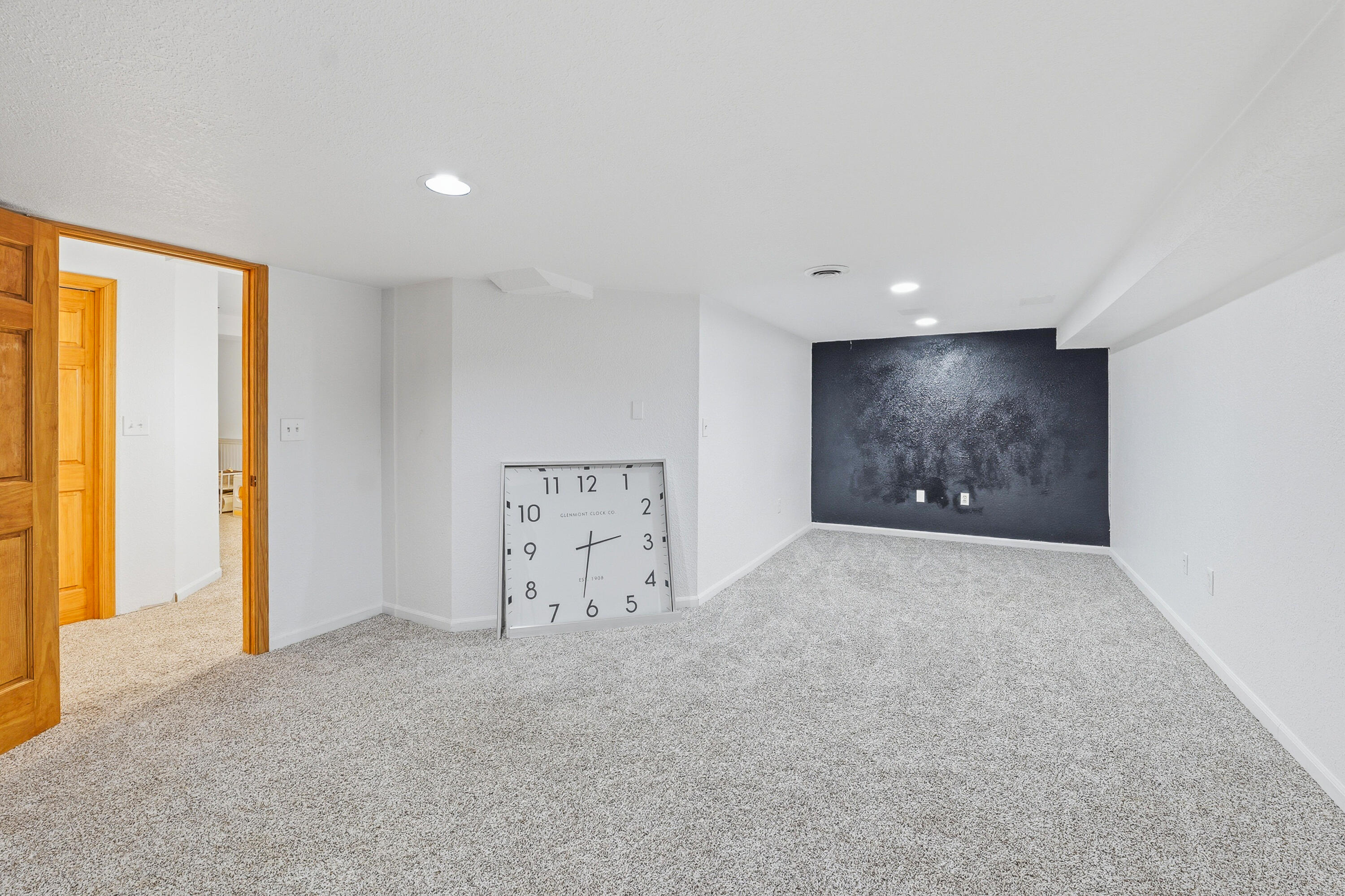 34899 Pabst Road Summit, WI 53066 - Photo 29 of 38 Large space with attached full bath—ideal for a home office, craft room, guest area, or flexible bonus space.
