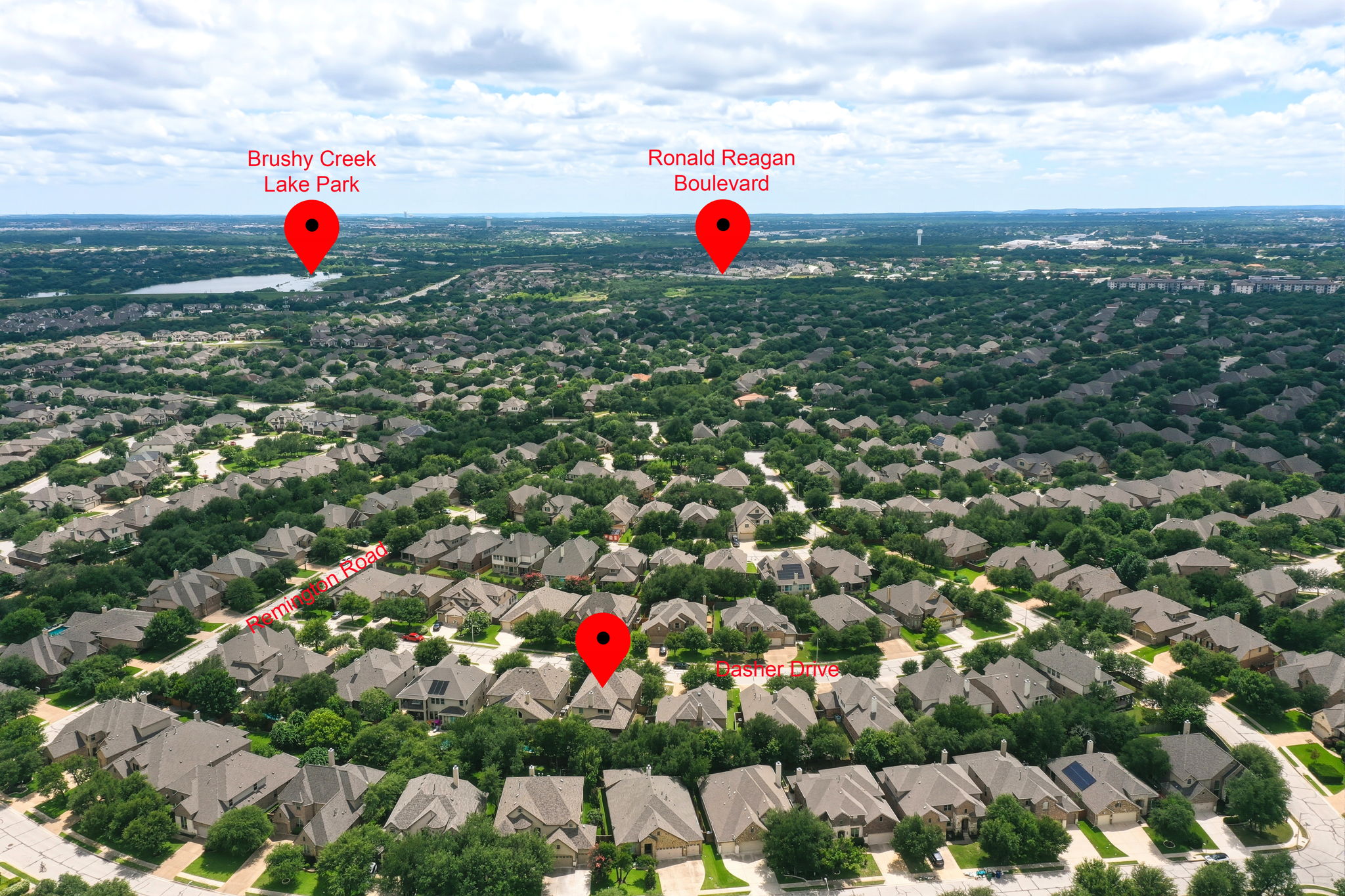 110 Dasher Drive Cedar Park, TX 78613 - Photo 32 of 39 An aerial perspective reveals a vibrant neighborhood with abundant green space and proximity to a picturesque lake park.