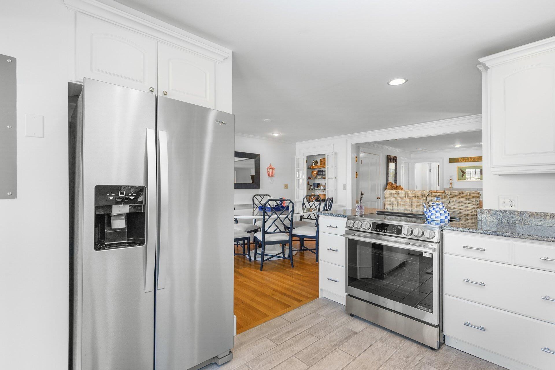 25 Main Street, Unit 3 Marion Center, MA 02738 - Photo 14 of 32 a kitchen with stainless steel appliances a stove a refrigerator and a refrigerator