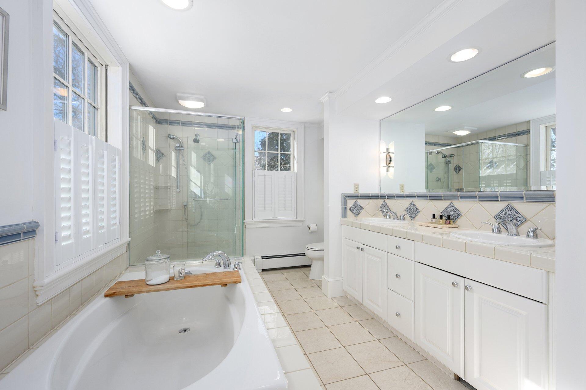 25 Main Street, Unit 3 Marion Center, MA 02738 - Photo 23 of 32 a bathroom with a sink a toilet and shower