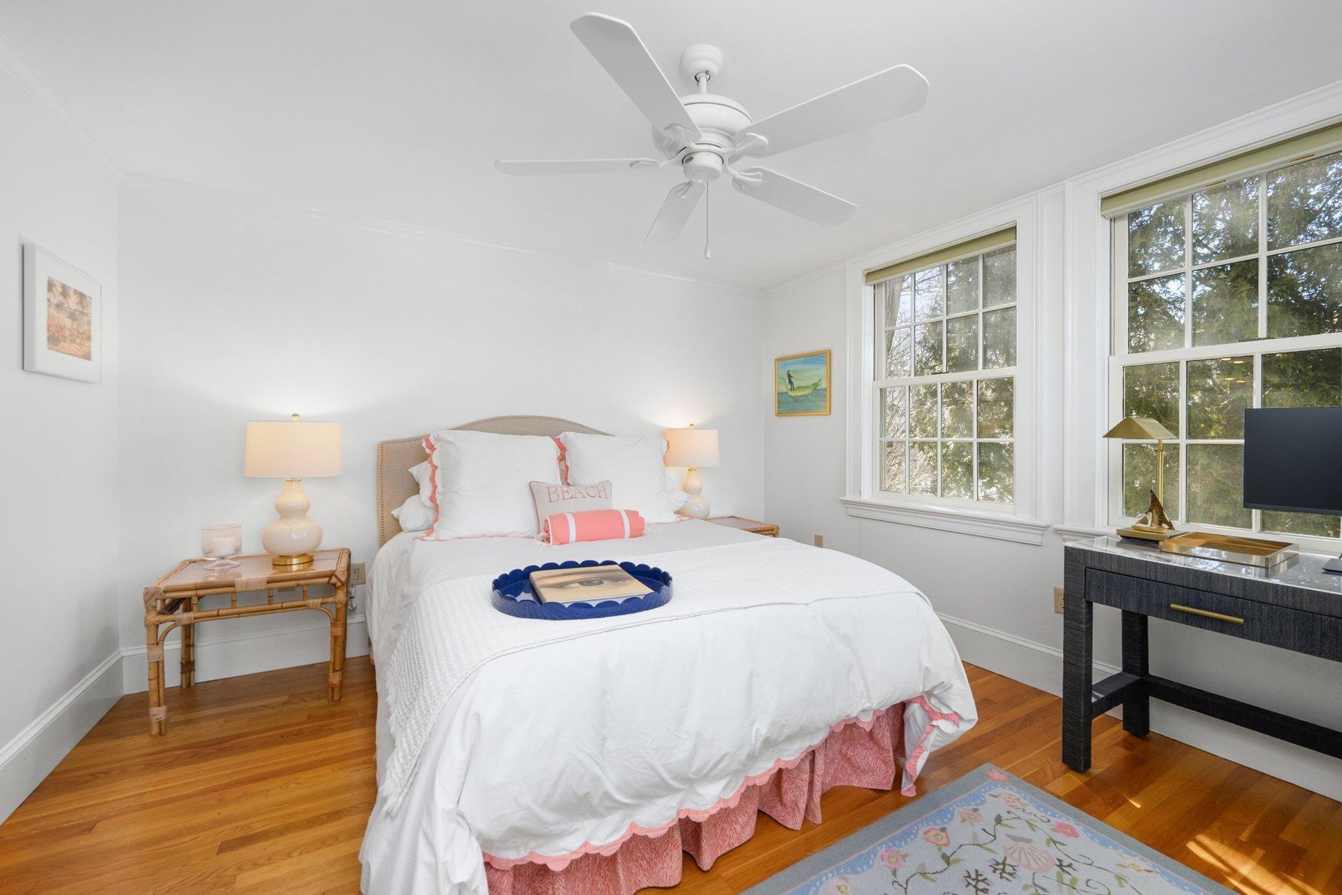 25 Main Street, Unit 3 Marion Center, MA 02738 - Photo 25 of 32 a bedroom with a bed and a table in it
