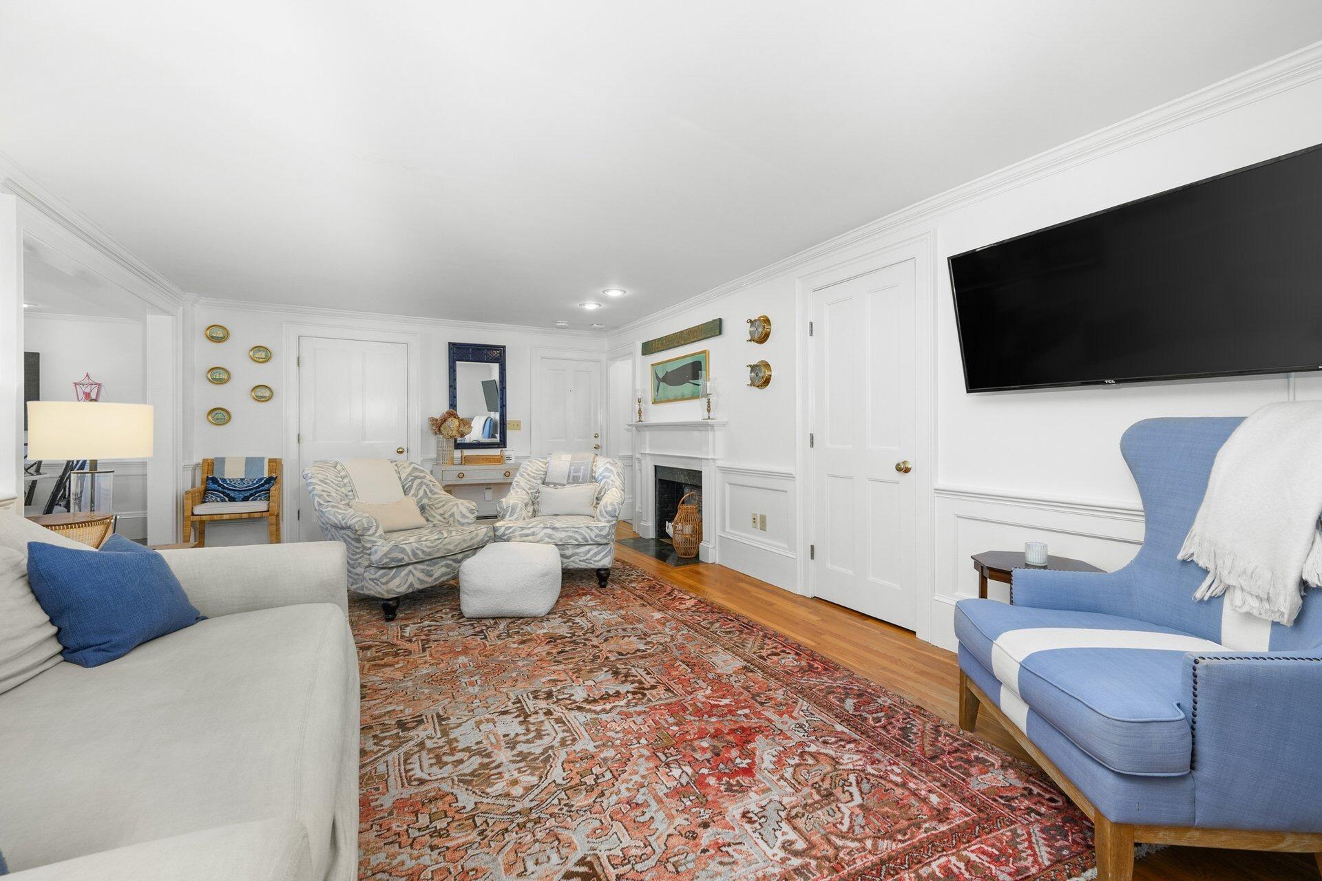 25 Main Street, Unit 3 Marion Center, MA 02738 - Photo 3 of 32 a living room with furniture and a flat screen tv