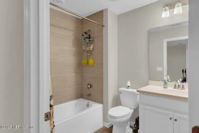 a bathroom with a sink toilet and bathtub