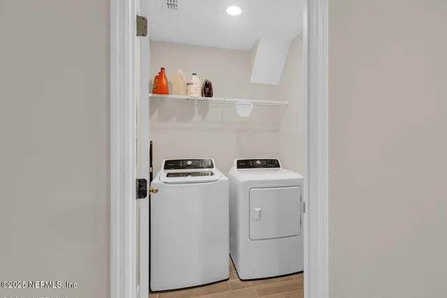 a utility room with dryer and washer