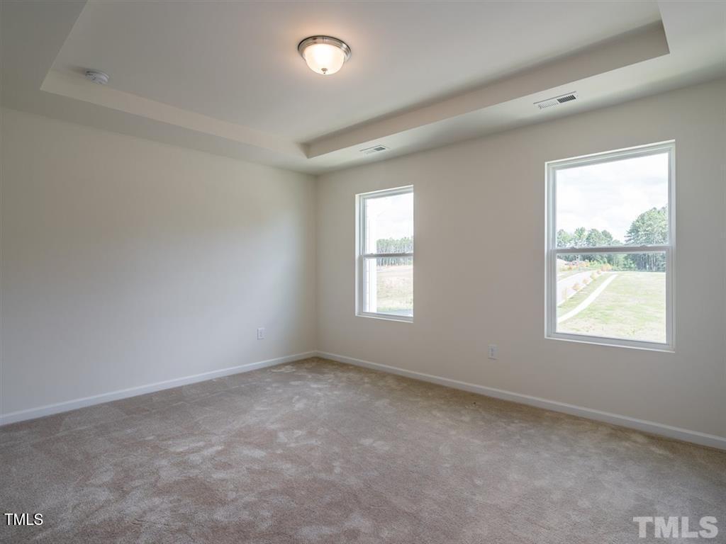 4035 Mahal Avenue Cary, NC 27519 - Photo 14 of 29 an empty room with windows