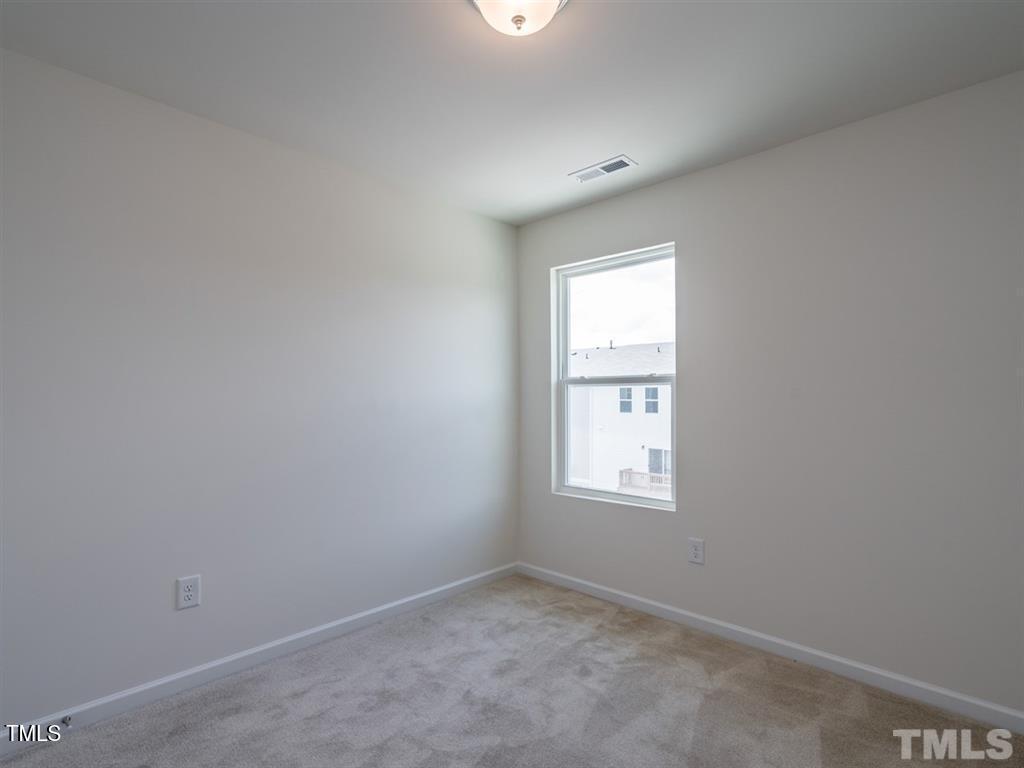 4035 Mahal Avenue Cary, NC 27519 - Photo 19 of 29 an empty room with windows
