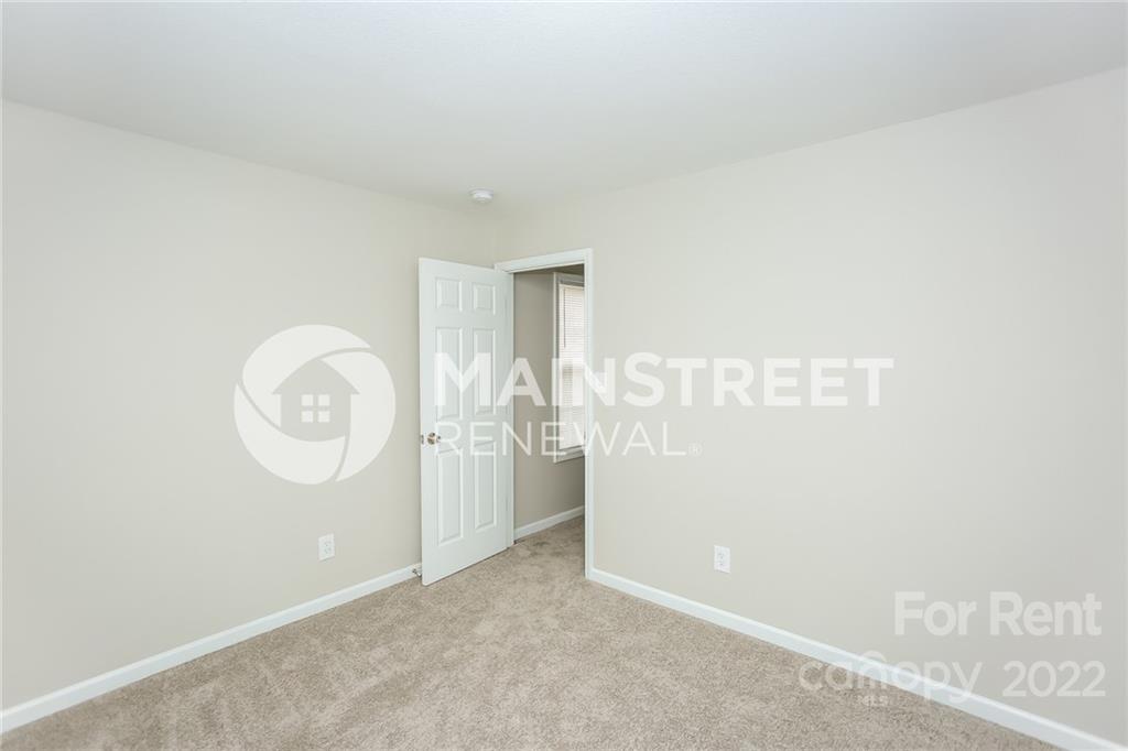 8566 Filbert Lane Charlotte, NC 28215 - Photo 12 of 32 a view of a room with wooden floor