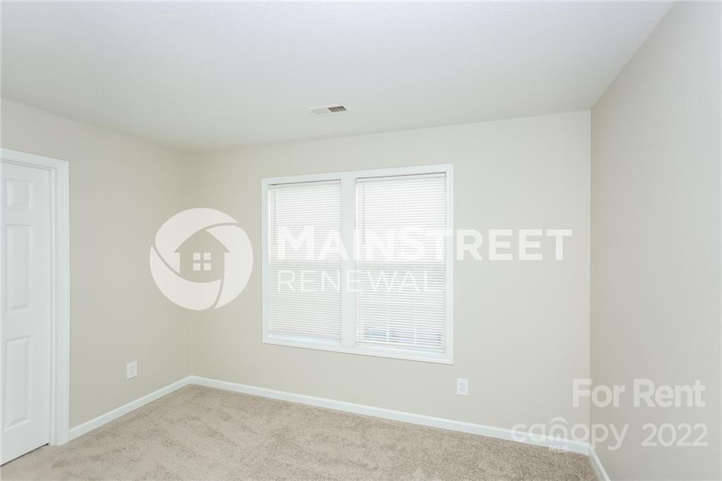 8566 Filbert Lane Charlotte, NC 28215 - Photo 15 of 32 an empty room with a window