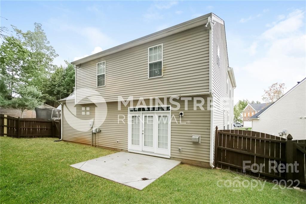 8566 Filbert Lane Charlotte, NC 28215 - Photo 17 of 32 a front view of a house with a garden