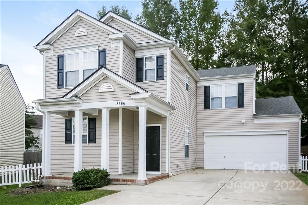8566 Filbert Lane Charlotte, NC 28215 - Photo 18 of 32 a view of a white house with large windows