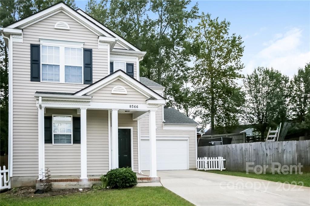 8566 Filbert Lane Charlotte, NC 28215 - Photo 19 of 32 a front view of a house with a yard