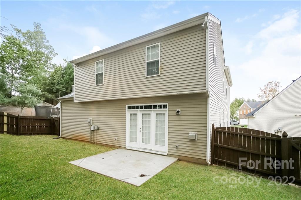8566 Filbert Lane Charlotte, NC 28215 - Photo 31 of 32 a view of a house with a backyard