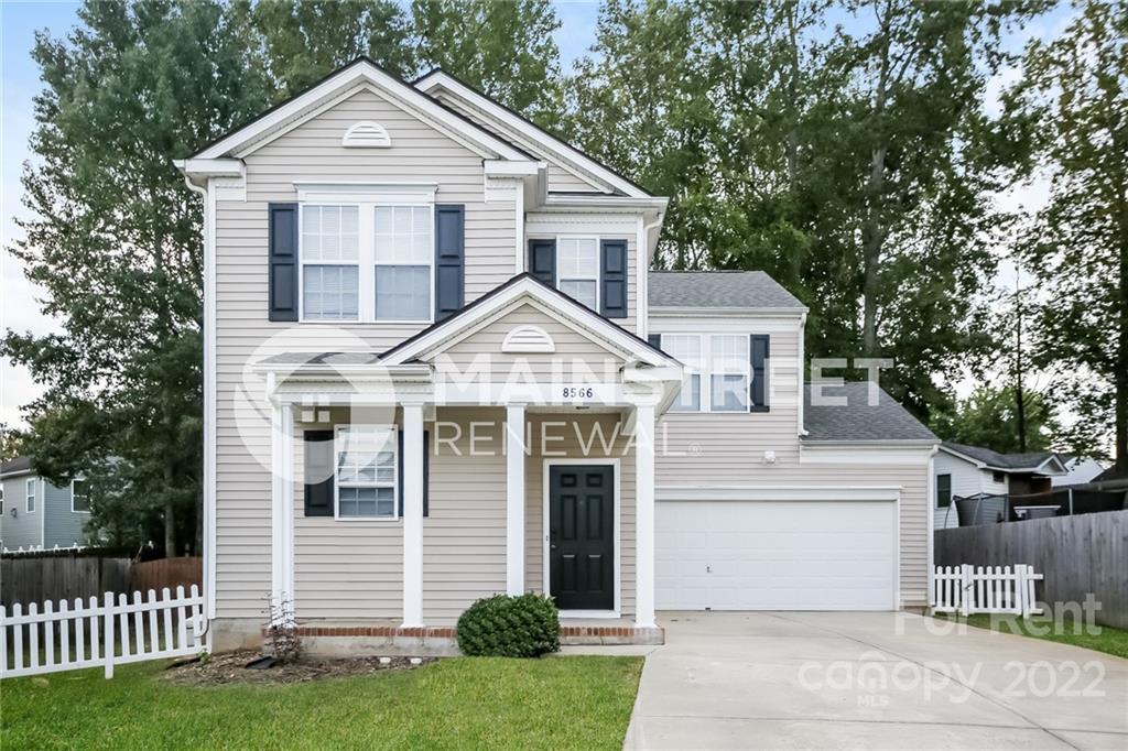 8566 Filbert Lane Charlotte, NC 28215 - Photo 4 of 32 a front view of a house with a yard