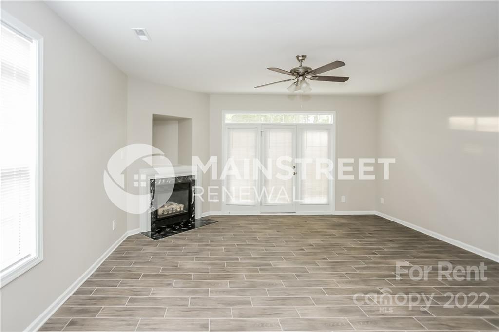 8566 Filbert Lane Charlotte, NC 28215 - Photo 7 of 32 a view of an empty room with a window