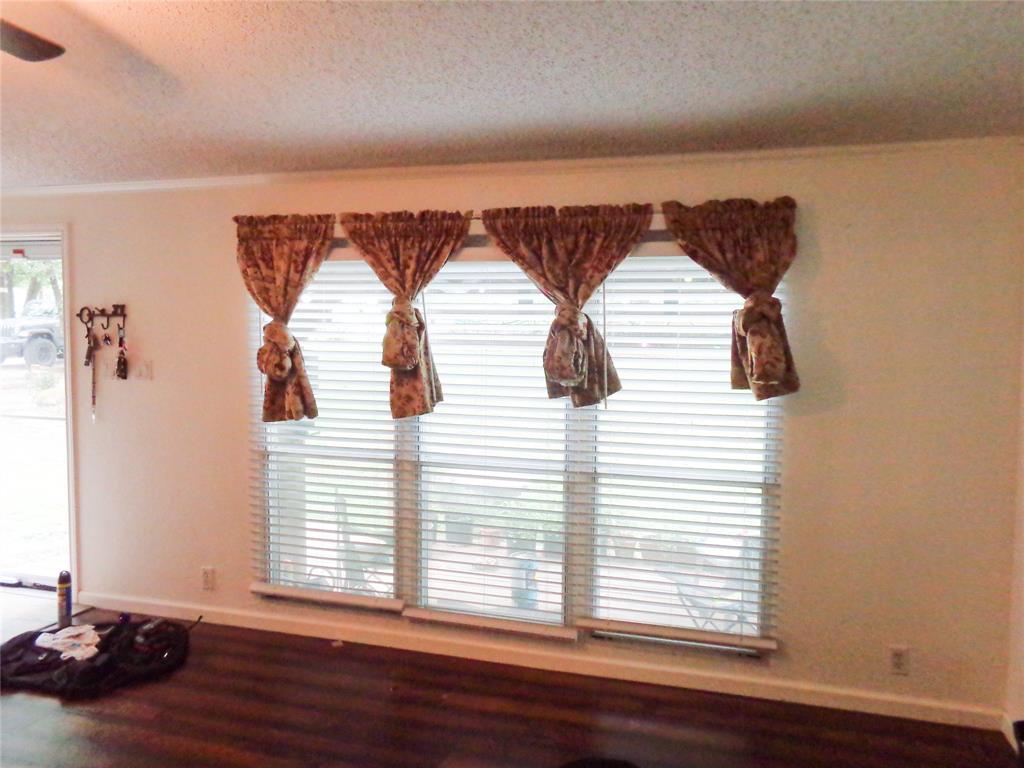 5525 Cedar Oaks Road Grandview, TX 76050 - Photo 11 of 40 Large windows and dark wood floors
