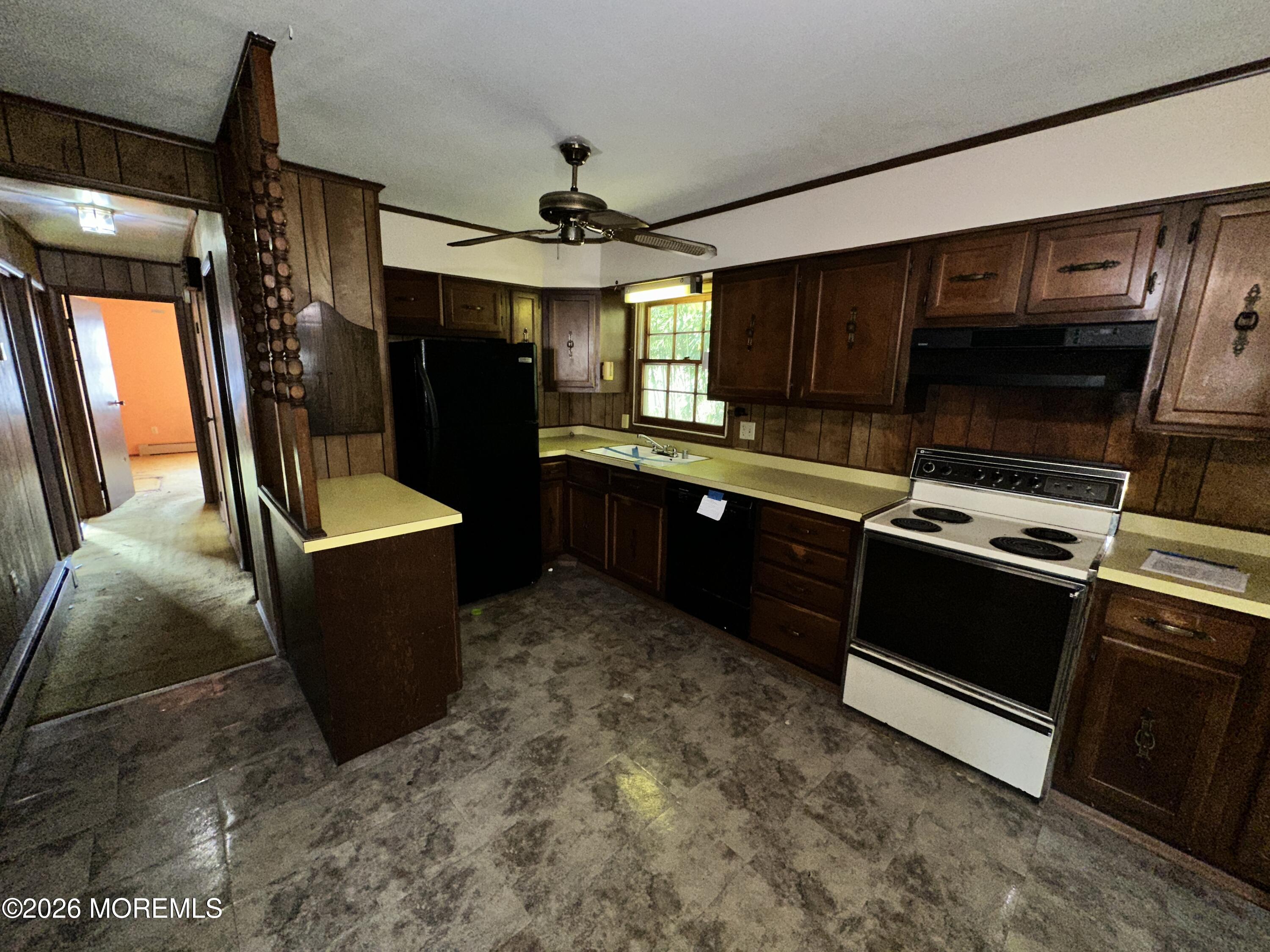 1894 West 4th Street Dunellen, NJ 08812 - Photo 17 of 23 a kitchen with stainless steel appliances kitchen island granite countertop a stove and a sink