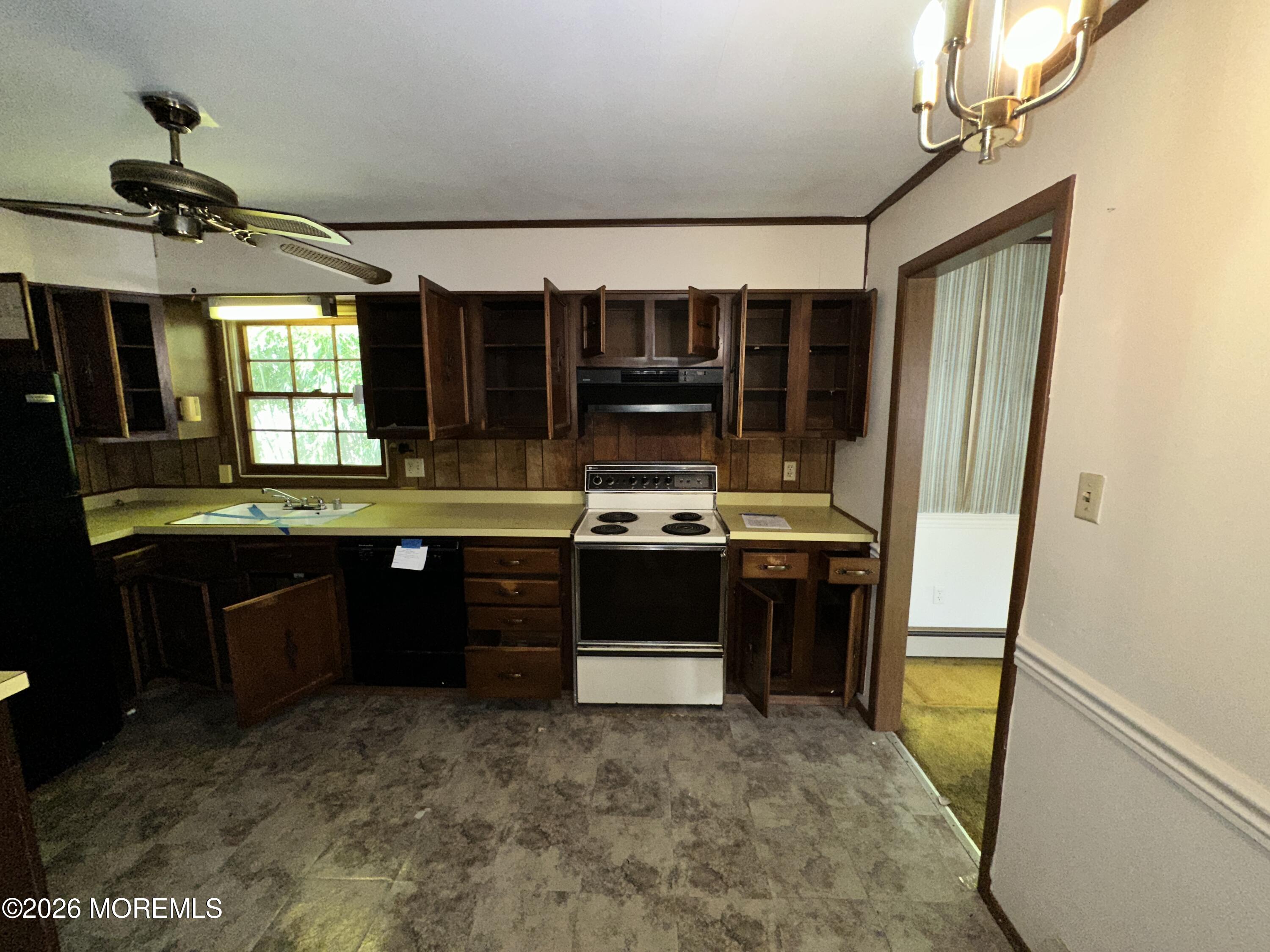 1894 West 4th Street Dunellen, NJ 08812 - Photo 23 of 23 a kitchen with a sink and a refrigerator