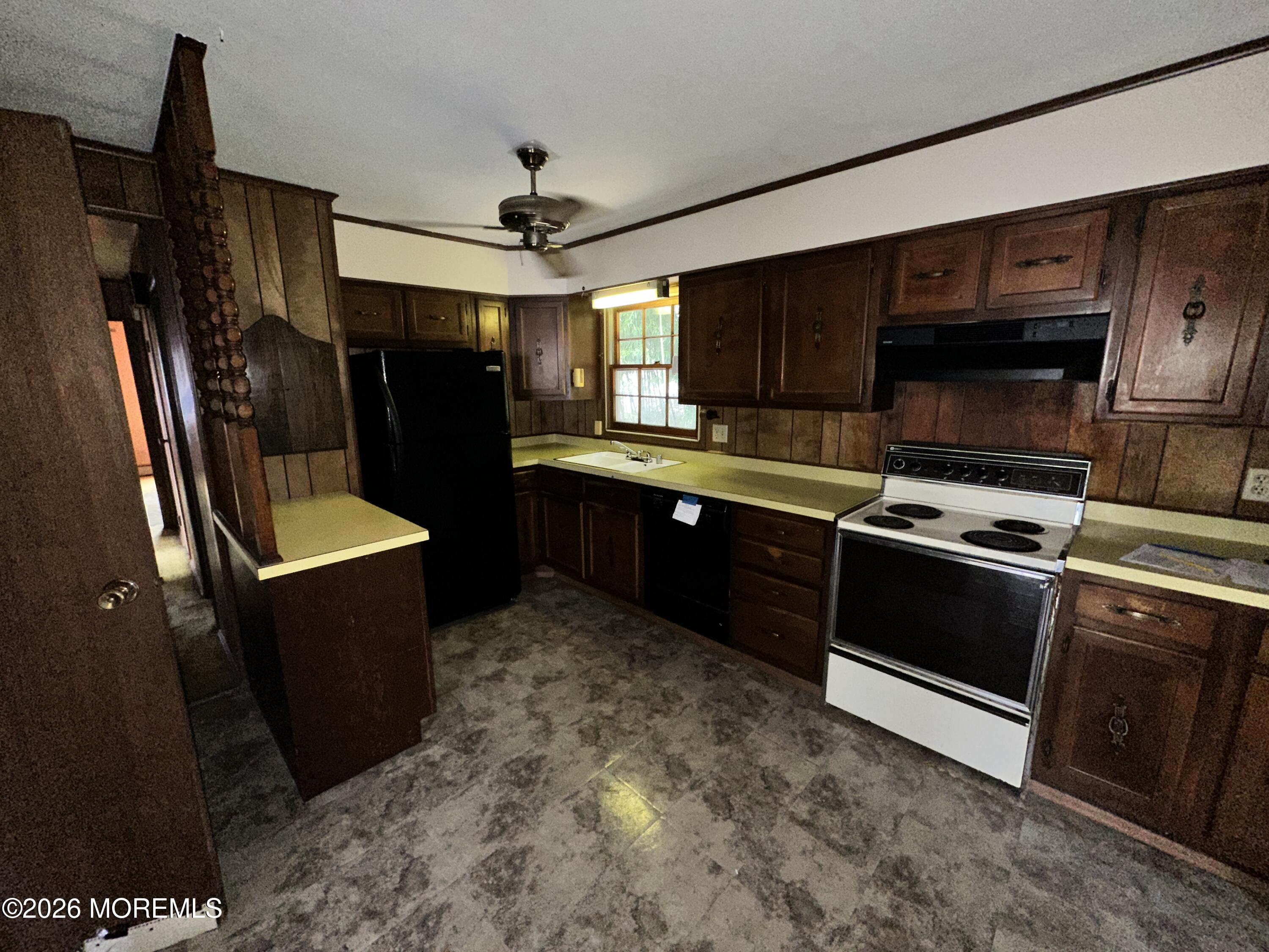 1894 West 4th Street Dunellen, NJ 08812 - Photo 5 of 23 a kitchen with a sink stove and refrigerator