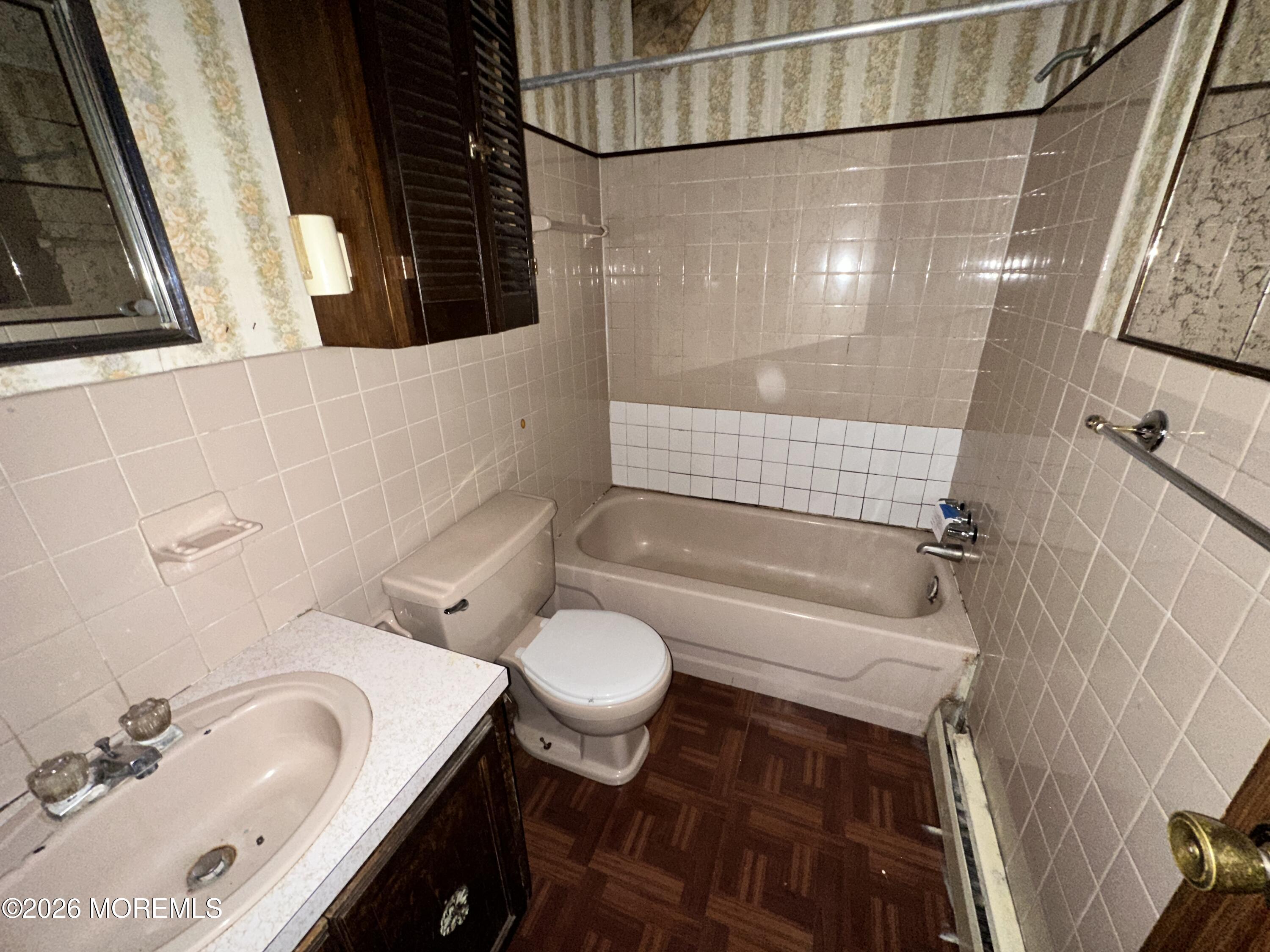 1894 West 4th Street Dunellen, NJ 08812 - Photo 6 of 23 a bathroom with a sink and a mirror