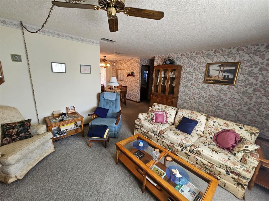 9115 Southwest 102nd Lane Ocala, FL 34481 - Photo 13 of 30 a living room with furniture and a couch