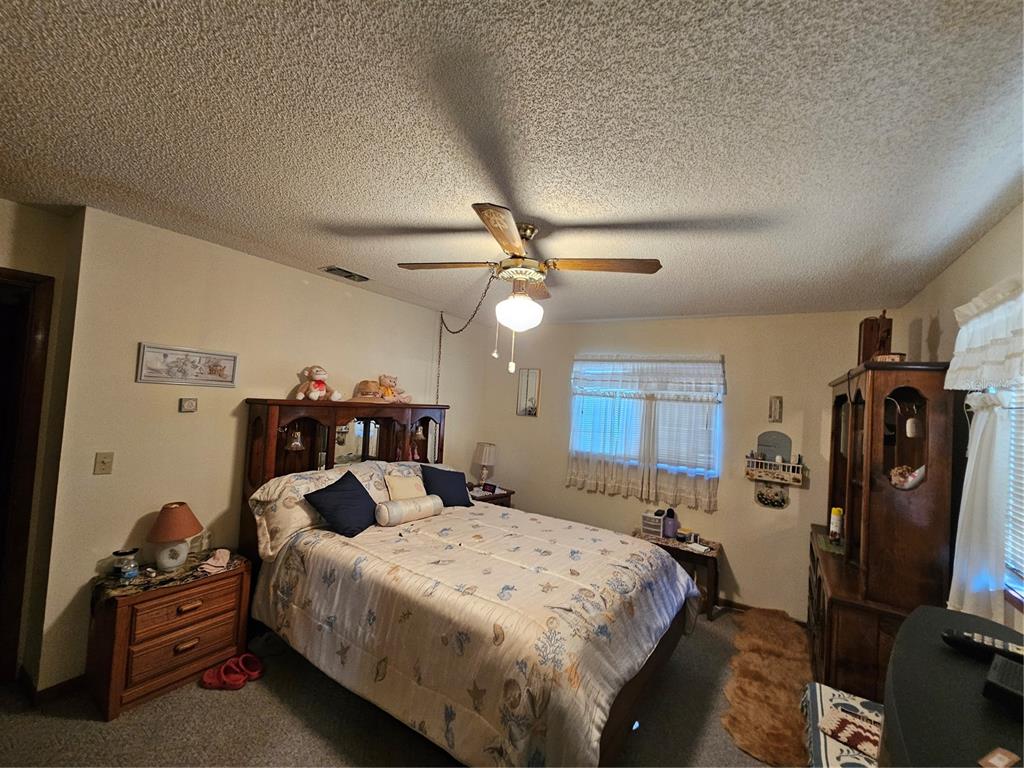 9115 Southwest 102nd Lane Ocala, FL 34481 - Photo 17 of 30 a bed room with a bed and a tv