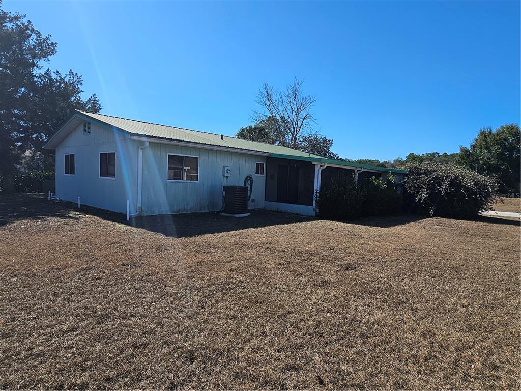 9115 Southwest 102nd Lane Ocala, FL 34481 - Photo 28 of 30 a view of a house with a yard