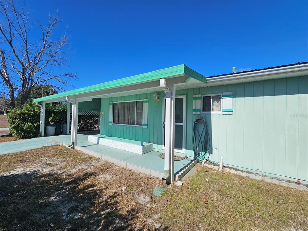 9115 Southwest 102nd Lane Ocala, FL 34481 - Photo 5 of 30 a view of a house with backyard and porch