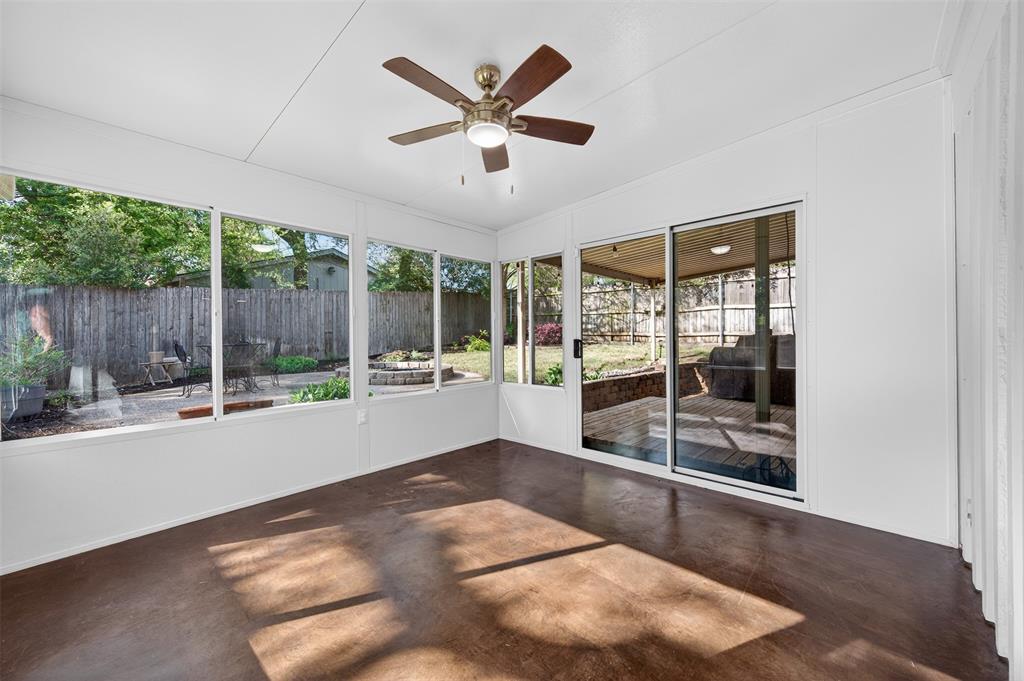 5008 Marble Falls Road Fort Worth, TX 76103 - Photo 11 of 33 a view of a livingroom with a ceiling fan and window