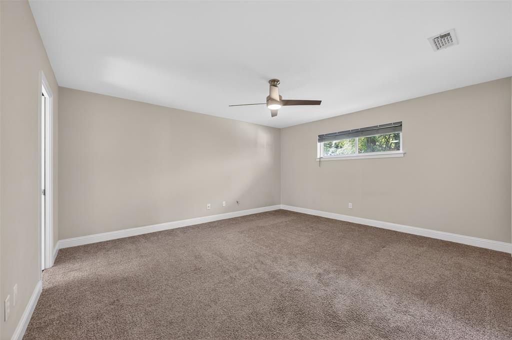 5008 Marble Falls Road Fort Worth, TX 76103 - Photo 12 of 33 a view of an empty room with a chandelier fan