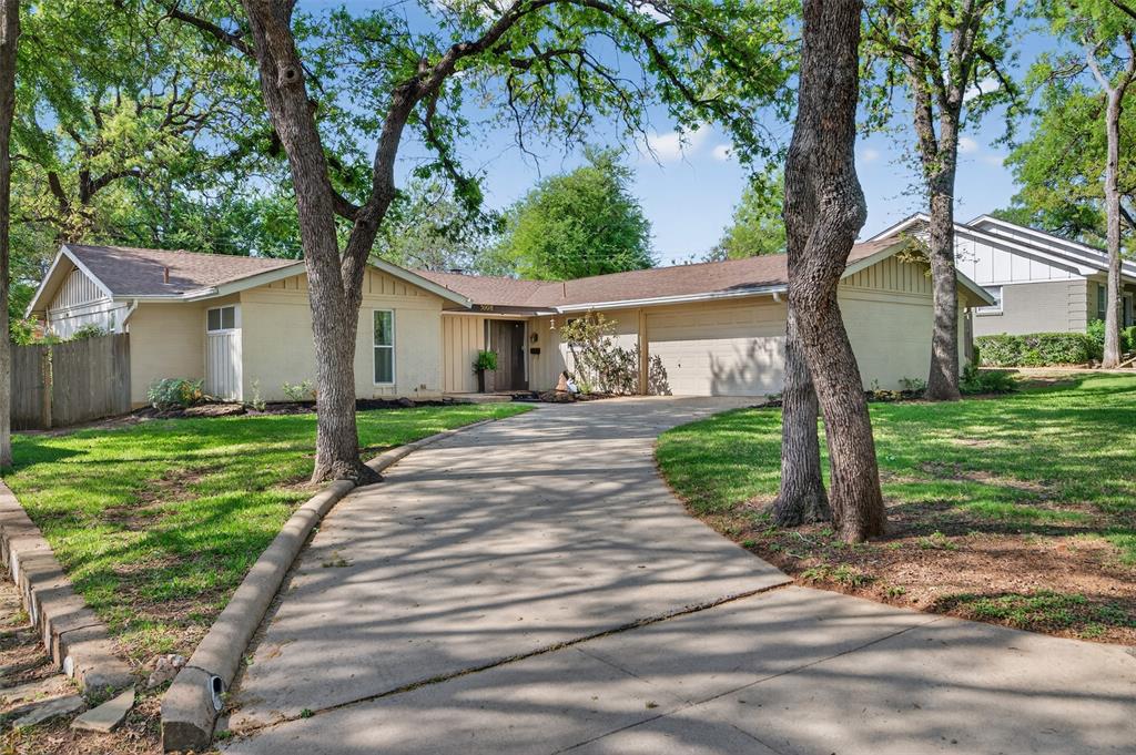5008 Marble Falls Road Fort Worth, TX 76103 - Photo 2 of 33 a front view of a house with garden