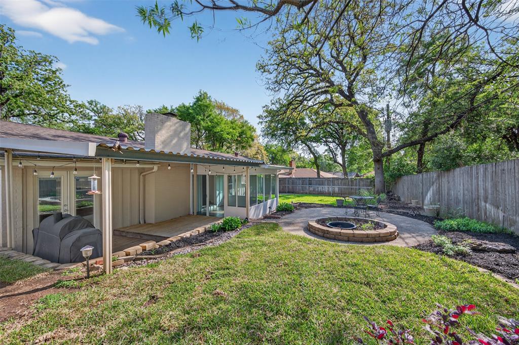 5008 Marble Falls Road Fort Worth, TX 76103 - Photo 25 of 33 a view of a backyard with plants and outdoor seating