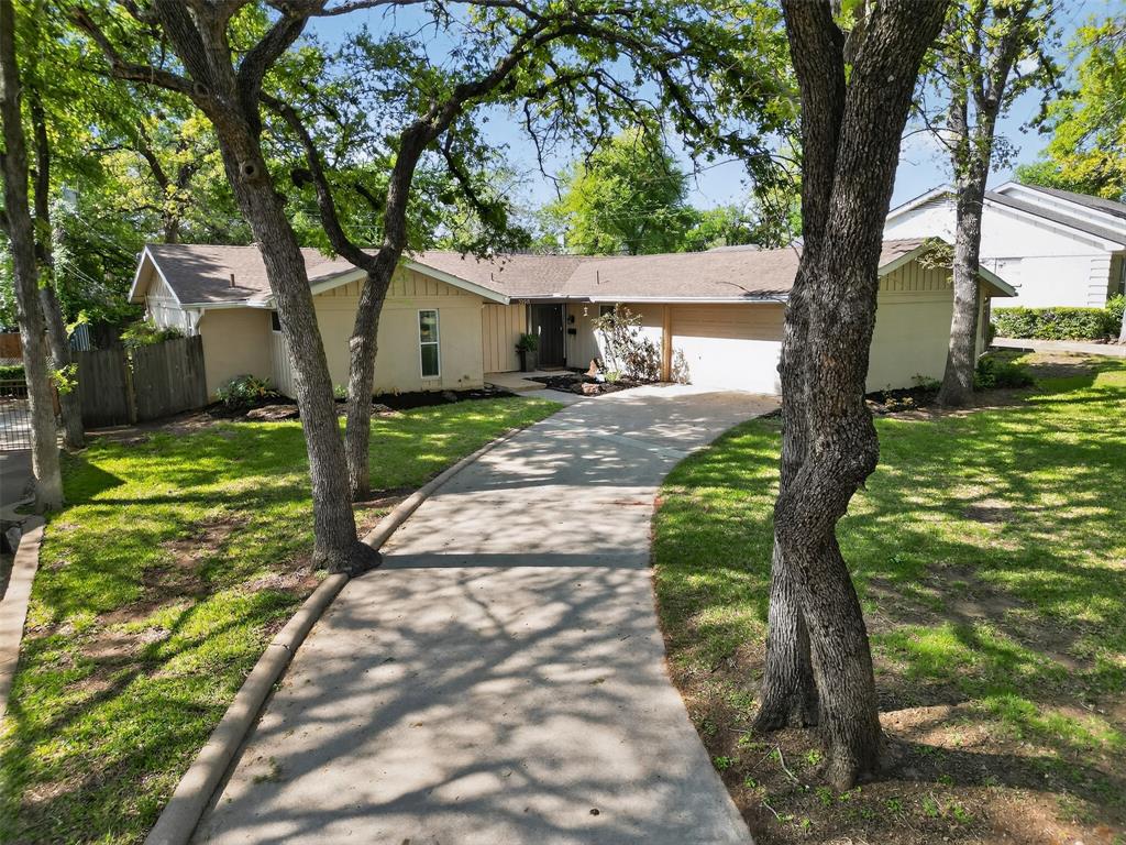 5008 Marble Falls Road Fort Worth, TX 76103 - Photo 28 of 33 a front view of a house with garden