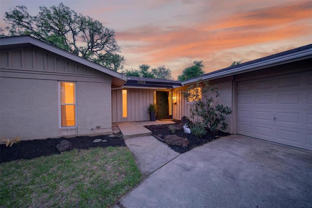 5008 Marble Falls Road Fort Worth, TX 76103 - Photo 31 of 33 a view of house with backyard and garden